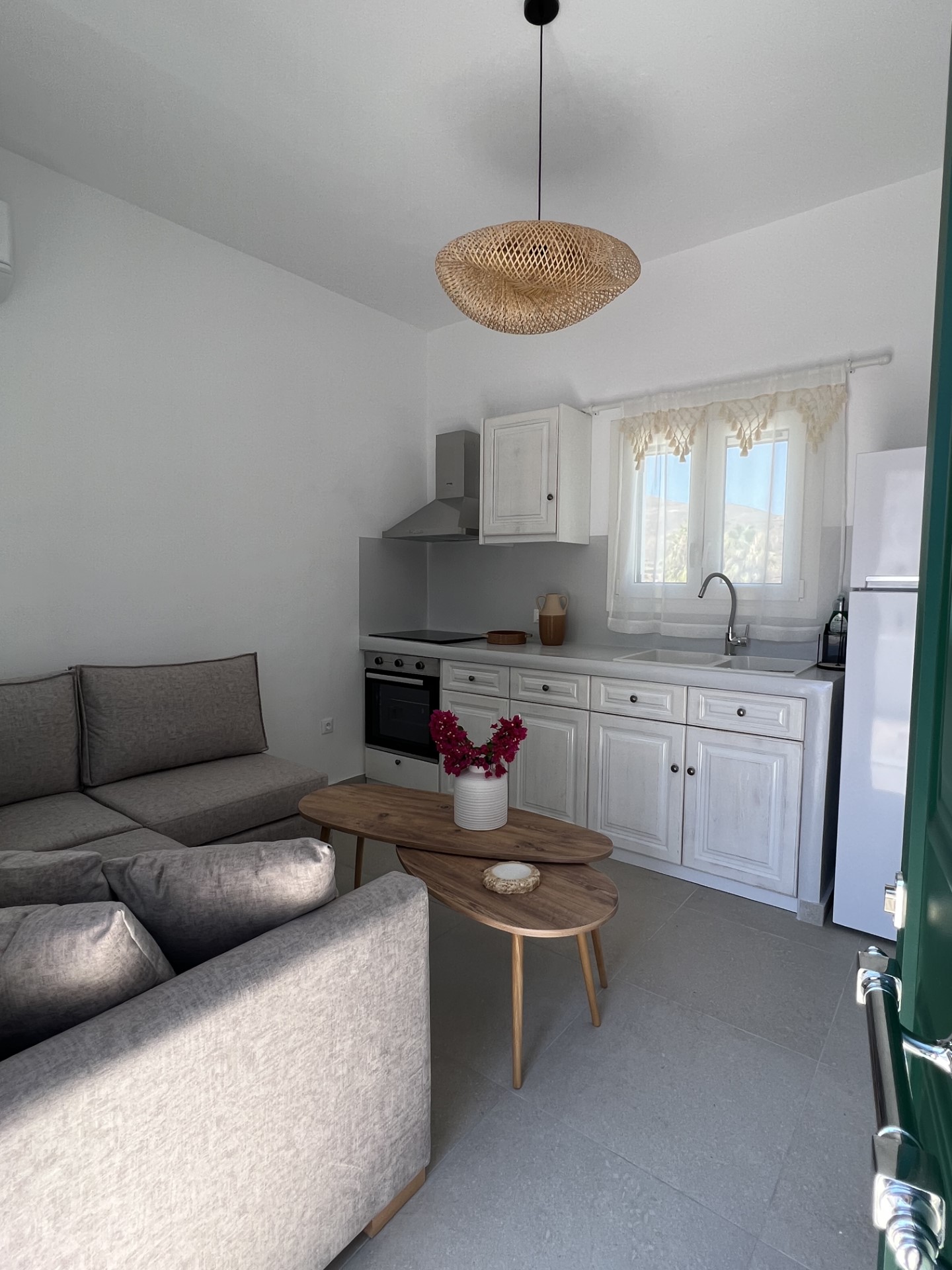 Ostria suite — cozy living area with kitchen