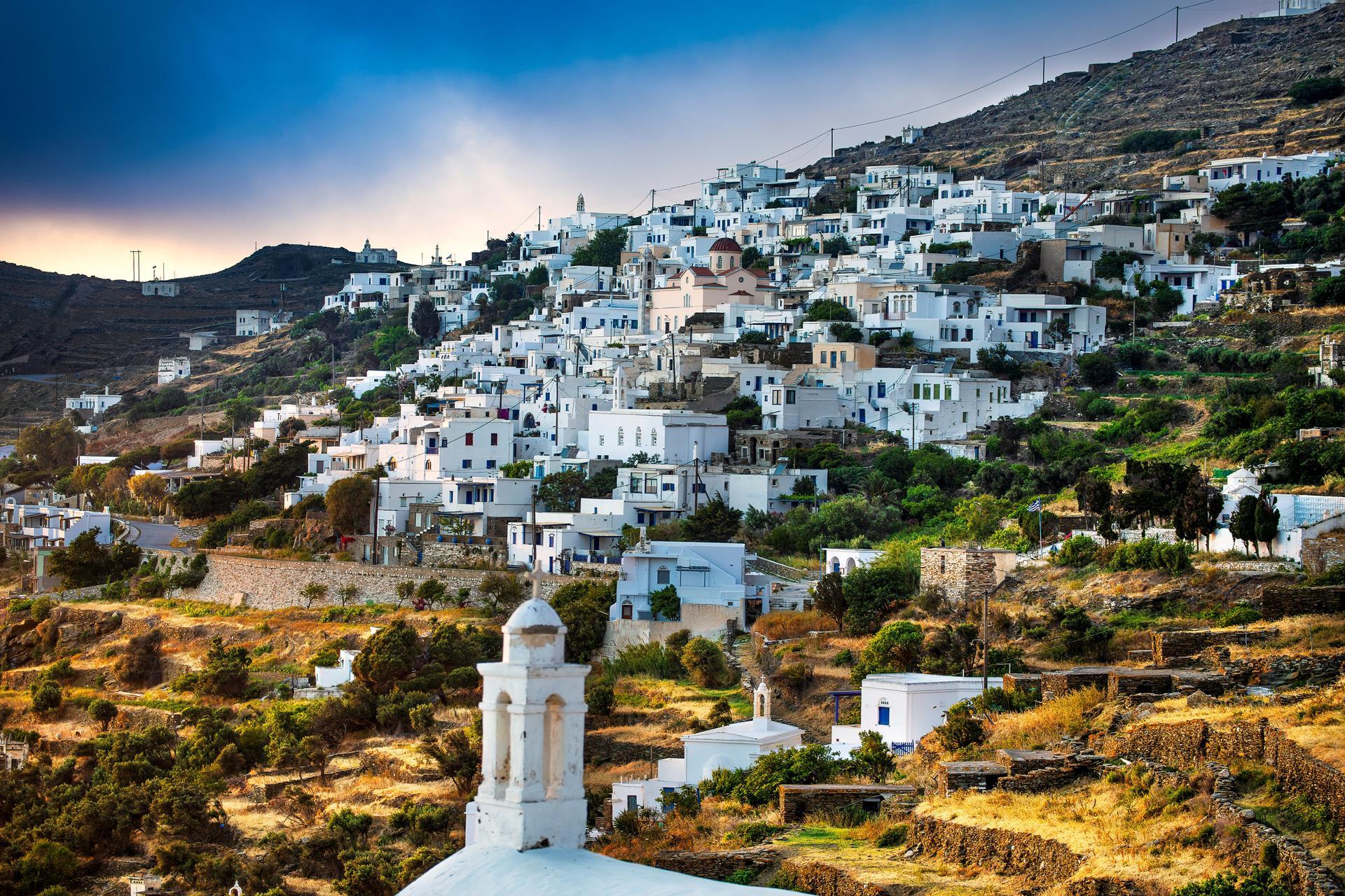 Traditional Tinos village with whitewashed houses and bougainvillea